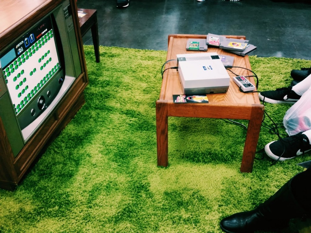 Rose City Comic Con Retro Gaming Area (a TV with a small table and a green rug) 2015: Legend of Zelda (photo by Amanda Vail)