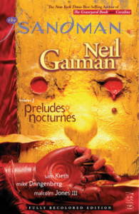 2010 cover of Preludes & Nocturnes, with a disembodied red marionette's hand lying before a gold wall with two circular holes filled with red that resemble eyes nad a shadow just above the hand that resembles a nose.