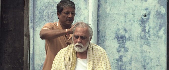 Rajiv (Adil Hussain) gives a head massage to his father (Lalit Behl)