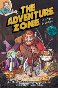 The cover of The Adventure Zone: Here There Be Gerblins. in which Griffin McElroy is dropping a 20-sided die onto a table where Taako, Magnus, and Merle are sitting, with Magnus' axe pointing at an X drawn on a map.