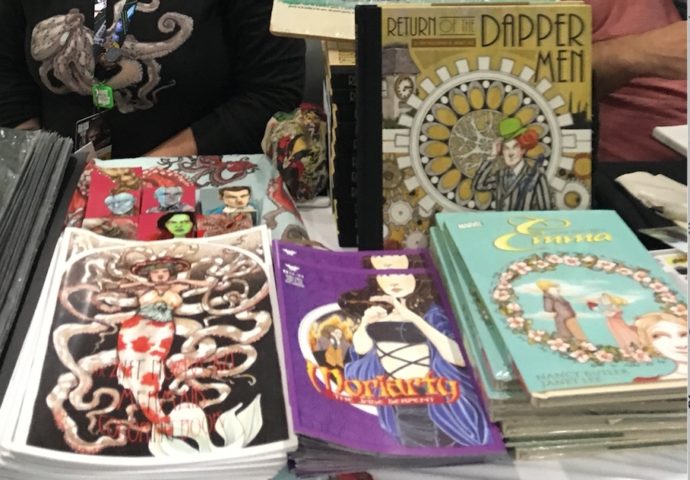 an assortment of items from Janet Lee's table at NYCC 2018