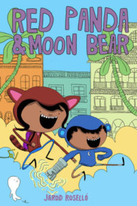 Cover for Red Panda & Moon Bear, IDW, Jarod Roselló, 2018 - Two kids, one in a red panda hoodie and the other in a blue bear hoodie, jump excitedly across the background of a city