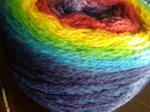 Kauni Effekt yarn cake in rainbow
