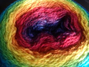 Kauni Effekt yarn cake in rainbow