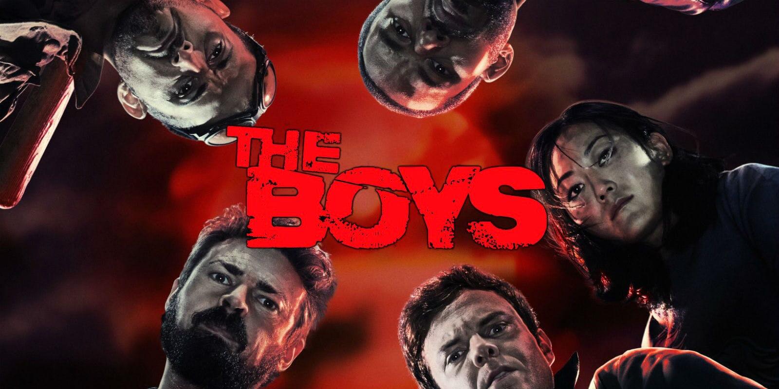 4 men and a woman standing in a circle look down at the camera, with the words "the Boys" in the centre