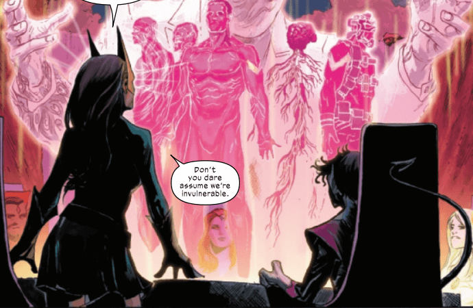 Jean Grey stands before a cocoon of bodies in pink chambers