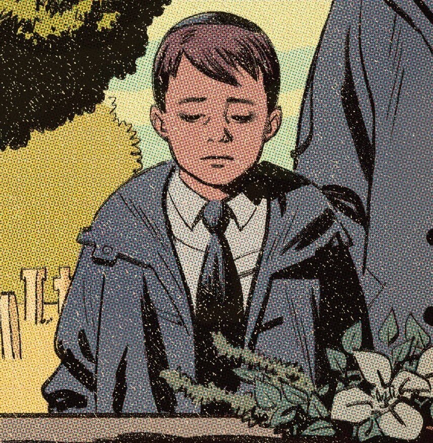 A young Ben Grimm at the funeral of one of his parents.