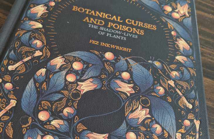 The gold-leafed cover of Botanical Curses & Poisons