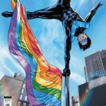 Nightwing balancing on a Pride flagpole