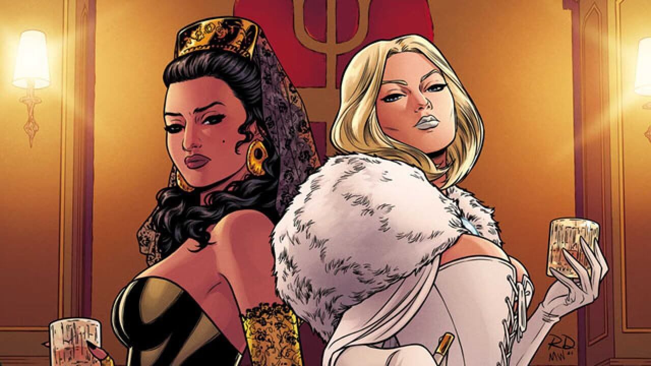 Emma Frost in white and Lourdes in black stand back to back over a large chess board. Emma uses a point to knock over the chess piece that looks like Sebastian Shaw