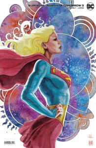 Supergirl standing arms on her hips in front of many planets