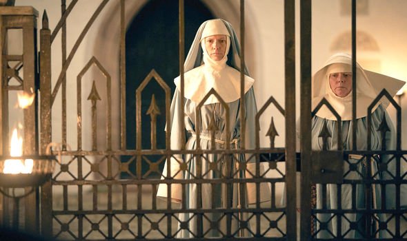 Still from episode 1 of the 2020 BBC/Netflix series Dracula, showing Dolly Wells as Sister Agatha and Joanna Scanlan as Mother Superior, standing at the gates of their convent.