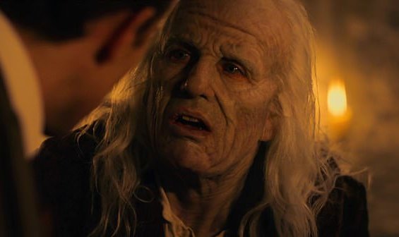 Still from episode 1 of the 2020 BBC/Netflix series Dracula, showing Claes Bang as Dracula wearing make-up to appear aged.