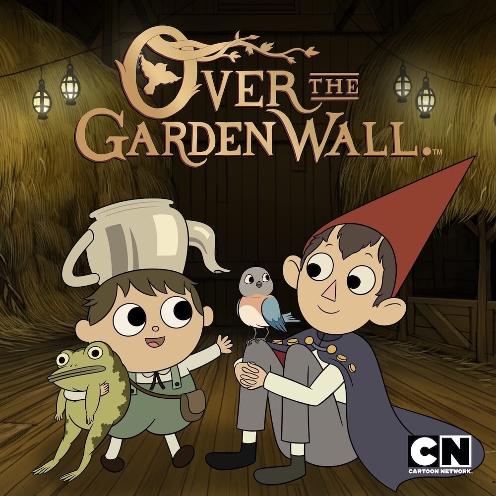 Greg, with the teapot on his head holding his frog, and Wirt, in his halloween costume with the red pointed hat and a bird on his shoulder, sit on a wooden floor under the title text.