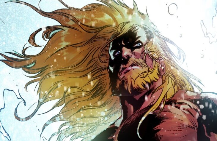 Dramatic close-up of Aquaman, hair blowing in the wind.