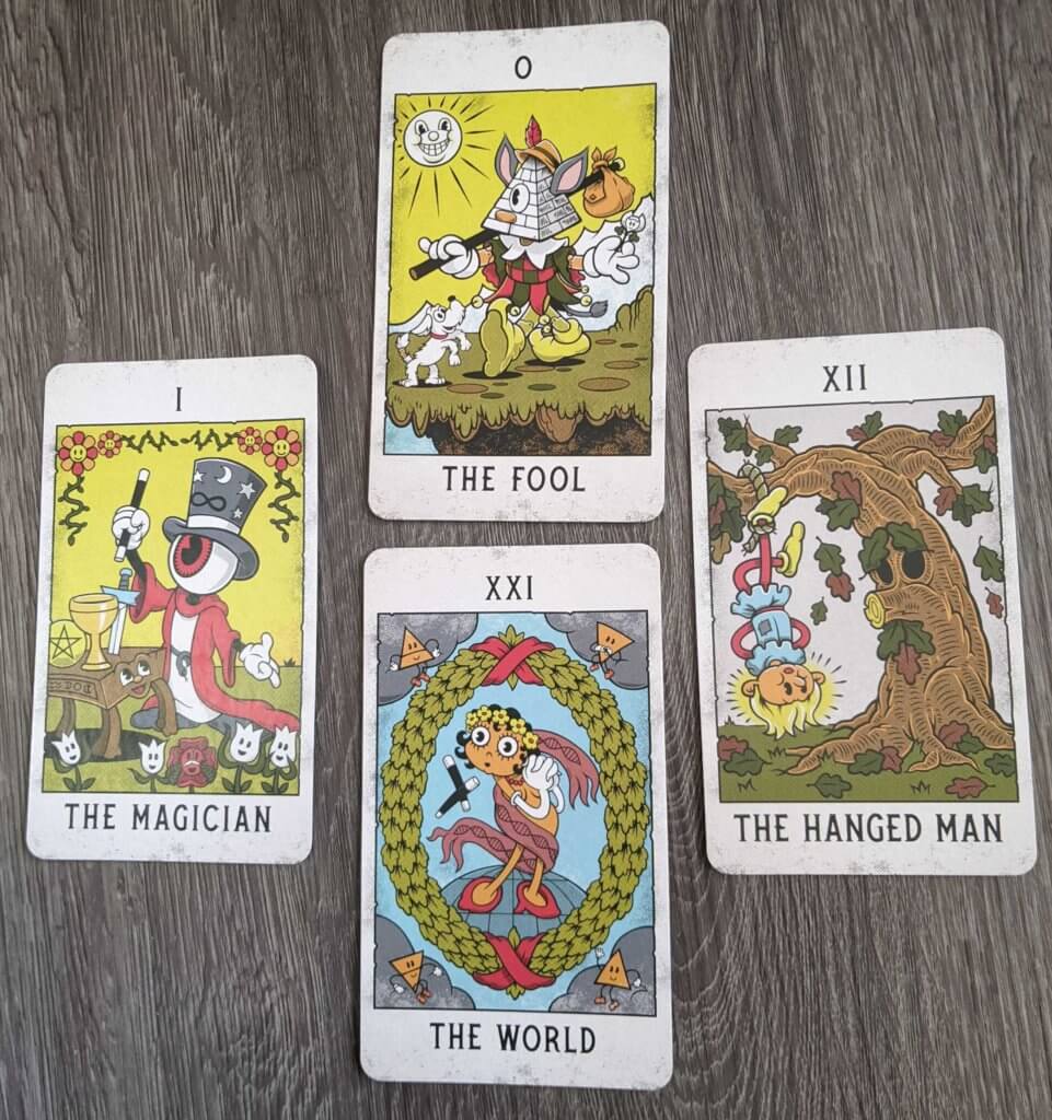 4 major arcana cards from Mystical Medleys: the Fool, the Magician, the Hanged Man & the World