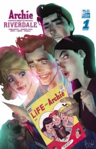 Archie Andrews, a white, redheaded teenager, holds opem a yellow-covered copy of of Life With Archie. He's surrounded by his friends Betty Cooper, a blond, white teenager with a ponytail, brunette white teenager veronica lodge, and white dark-haired teenager jughead jones. Archie looks excited, Betty looks amused, Veronica looks skeptical and jughead looks sanguine