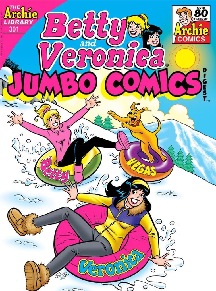 Veronica Lodge - a white, brunette teenager - rides down the side of a snowy mountain in an inner tube. The inner tube is hot pink and has her name in blue writing on the side. She's wearing a yellow and purple ski jacket, a yellow headband, and grey pants with tan ugh boots. Tubing down beside her at a distance is Betty Cooper, a white blonde teenager with her hair in a ponytail. She's wearing a pink ski jacket and black pants with pink boots -she's causing more of a stir and kicking up more snow, as her yellow innertube has run into Vegas', Archie's golden retriever. The dog's leaping into the air as he stands in his innertube. It's a sunny day outside, the sky is blue with white clouds dotting the horizon, and there is a blue-tinged mountain and green pine trees off in the distance
