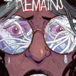 A close up of a frightened woman with the image of a tentacled monster reflected in her glasses