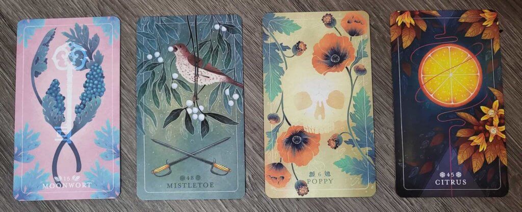 Four cards from the Seed and Sickle Oracle: Moonwort, Mistletoe, Poppy, Citrus