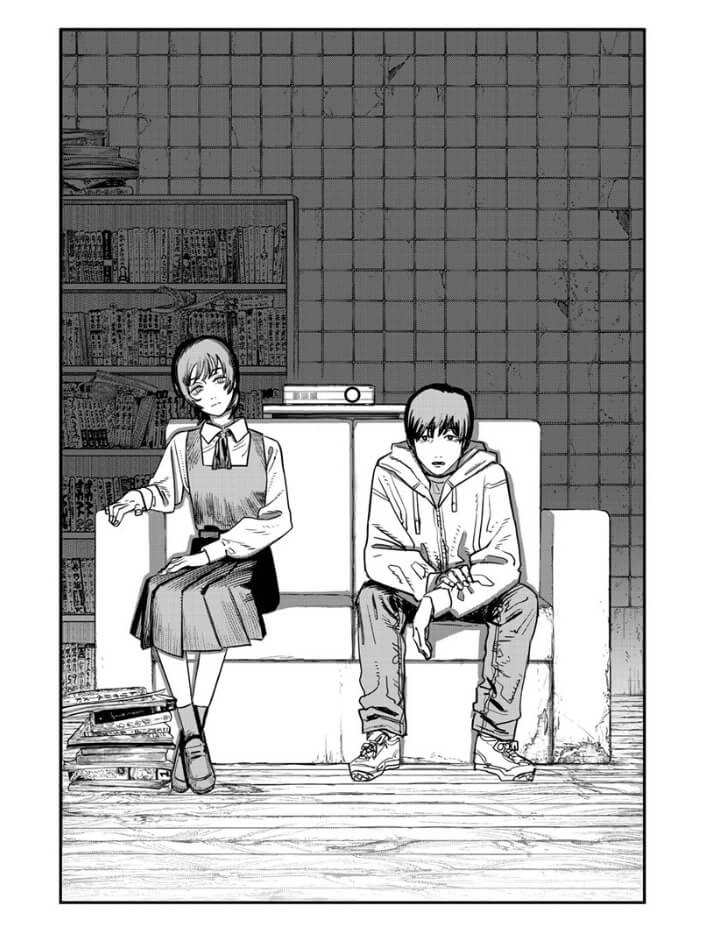 A black and white illustration of a pair of two young teenagers sitting on a couch within a derelict space. A shelf of various catalogs and movies stands in the background. They are illuminated and looking towards the foreground at a screen off-frame.