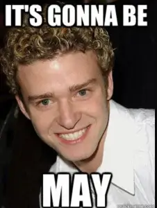 A picture of singer Justin Timberlake with the words "It's gonna Be" on top and "May" on the bottom in large white capital letters