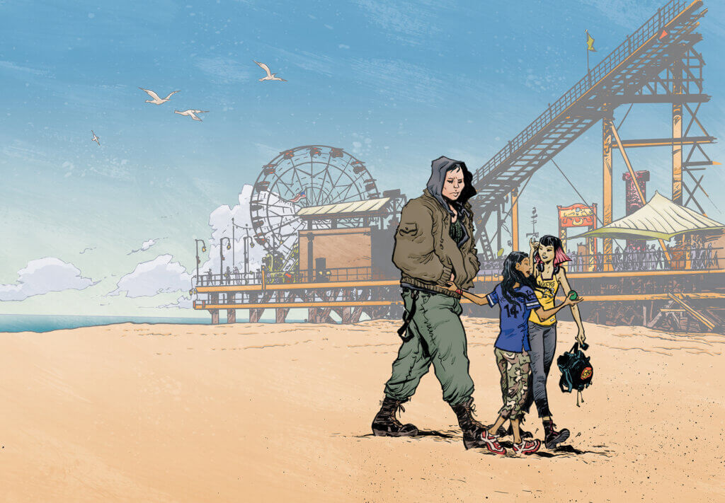 A hooded man and two smaller people walk along a beach. A ferris wheel is behind them.