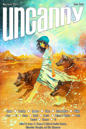 Cover of Uncanny Magazine issue 40 . Illustration shows a woman in a light dress walking through a desert, accompanied by large canines.