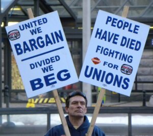 This was a pro-union rally in response to recent union issues in Wisconsin. They support wage earners, labor unions and collective bargaining. They're against corporate tax breaks, large bonuses for company executitves and concentration of wealth in the upper income levels. Signs read: UNITED WE BARGAIN DIVIDED WE BEG PEOPLE HAVE DIED FIGHTING FOR UNIONS.