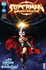 Superman in battle gear holding Warworld in his hand