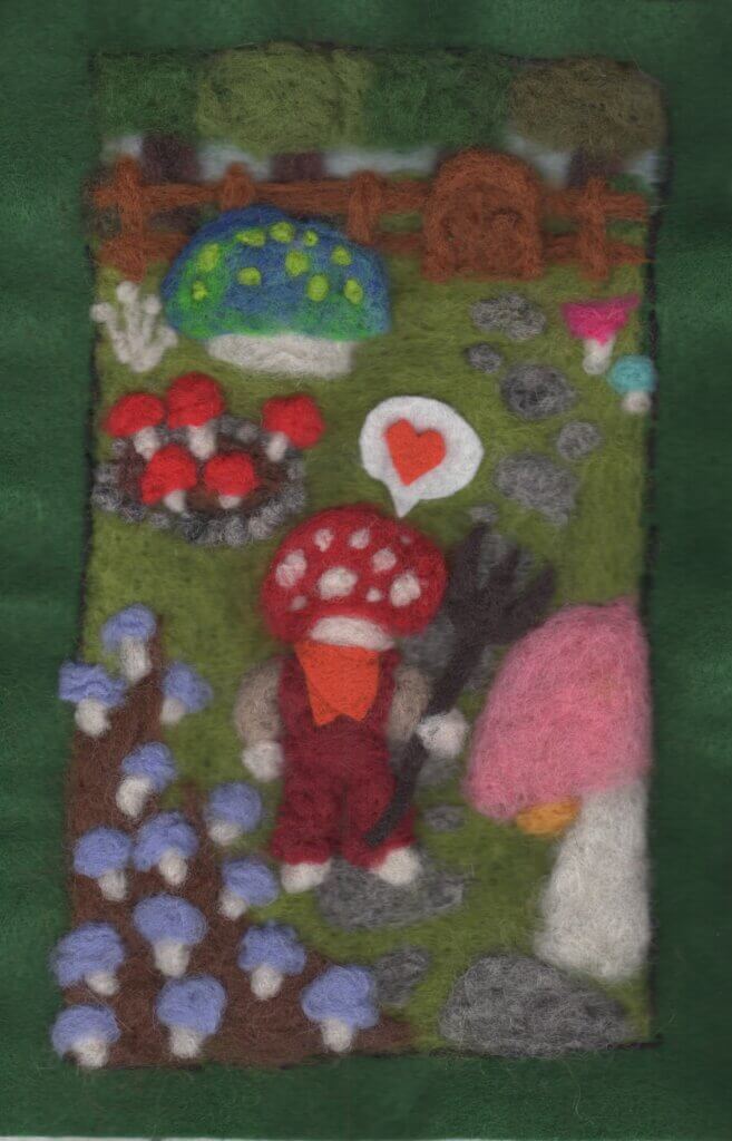 A needlefelted mushroom gardener is gardening mushrooms in this preview page by Filipa Estrela from Meandering Realms.