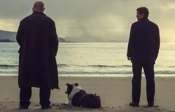Brendan Gleeson and a dog stare at the see and a cloudy sky, their backs to us. Next to them at a slight distance is Colin Farrell, glancing at Gleeson.