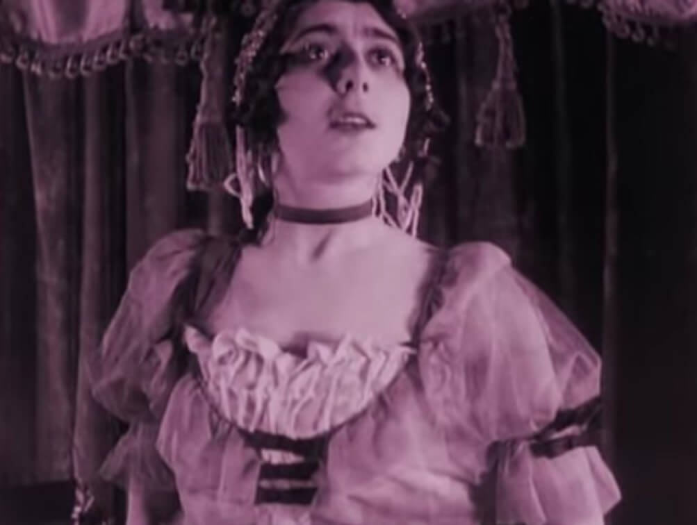 Still from the film After Death (1915). Vera Karalli portrays the singer on stage.
