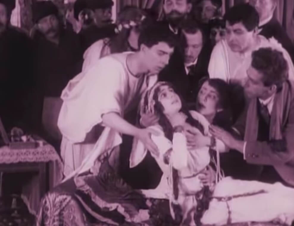 Still from the film After Death (1915). Vera Karalli portrays the singer on stage as she dies of posioning.