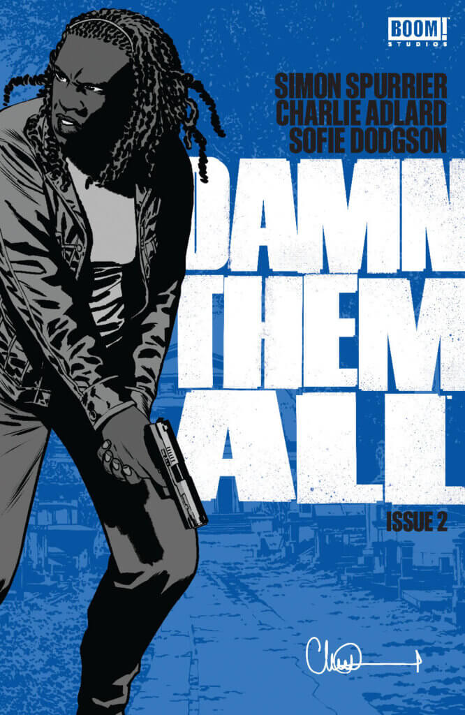 The cover to Damn Them All #2, showing Nora, a Black woman, holding a gun and looking over her shoulder. In the background is the Boom! Studios logo, and text reading Simon Spurrier, Charlie Adlard, and Sofie Dodgson, as well as the issue title and number. 