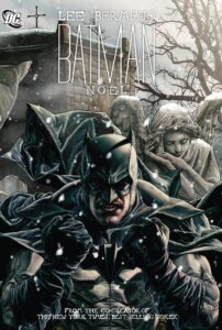 Batman with a stone statue behind him and snow falling
