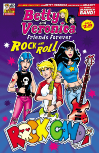 Jola Kitt - a white thin teenager with blue shoulder-length hair - stands confidently beside Betty Cooper and Veronica Lodge. Both Betty and Veronica are thin white teenagers. Betty has long, blond hair held up in a ponytail; Veronica has long dark hair that cascades past her shoulders. Jola wears sleeveless black teeshirt with a white skull on the chest and purple trousers with a black belt; she also has a red, heart-shaped tattoo. Betty's hair tie is black, and she wears a red-sleeved baseball teeshirt and clutches a green electric guitar with a green fretboard, neck and body. Veronica wears a blue babydoll top with a gold star on the chest and jeans with a black belt. She holds a red-bodied electric bass guitar. Behind them, on a dark purple backdrop, multicolored hot pink and dark purple splotches rain down.