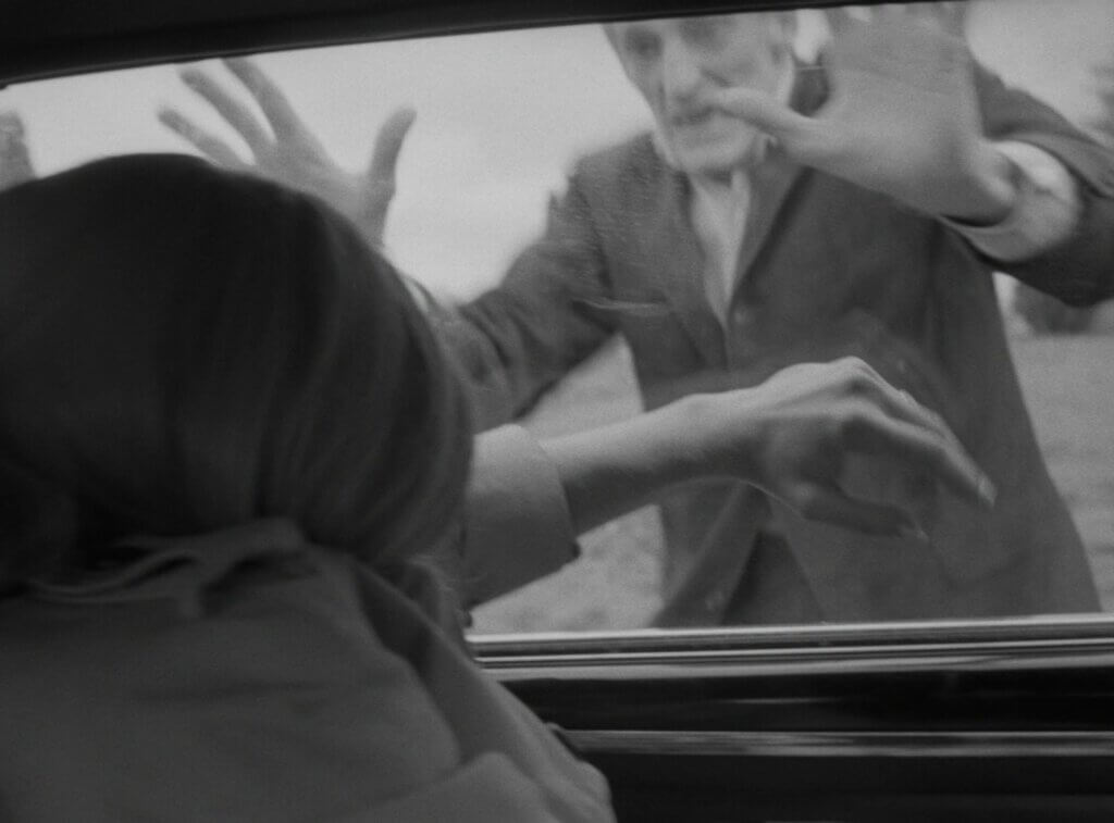Still from the film Night of the Living Dead. Barbara (Judith O'Deah) is attacked in her car by a ghoul (Bill Hinzman) Obtained from Fancaps.net.