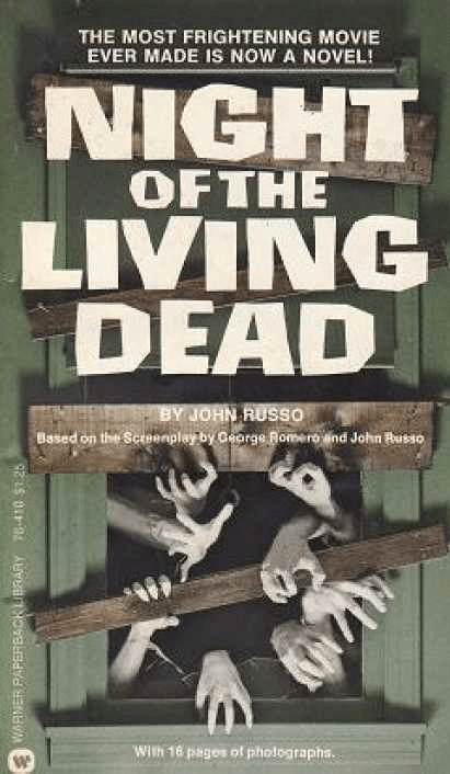 Cover of John Russo's novel Night of the Living Dead. Illustration shows zombie hands reaching through a window.