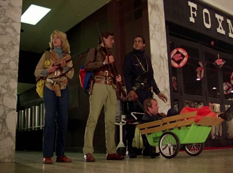 Still from the 1978 film Dawn of the Dead showing the film's main cast, armed with guns.