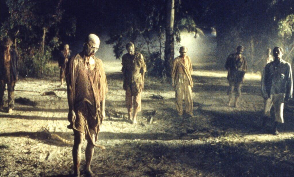 Still from Lucio Fulci's film Zombi 2, showing a group of zombies.