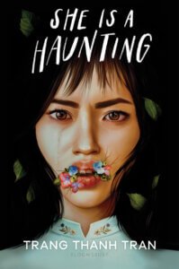 A face cries and has flowers over the corners of the mouth on the cover of She is a Haunting, by Trang Thanh Tran