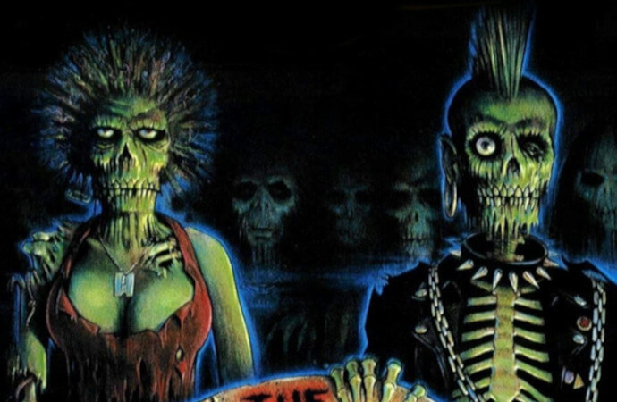 Detail from the poster for the film Return of the Living Dead. Shows a cartoonish depiction of zombies wearing punk fashion in a graveyard.