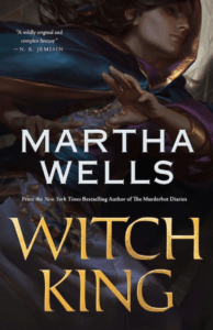 Cover of Martha Wells' novel Witch King, showing an extreme close-up of a character in lavish period dress.