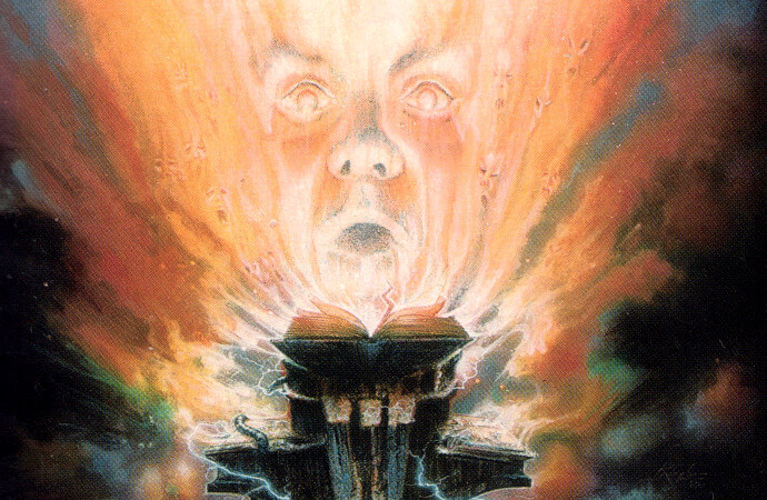 Detail from the cover of the 1989 short story anthology Book of the Dead. Illustration shows a ghostly, distorted face looming over an open book.