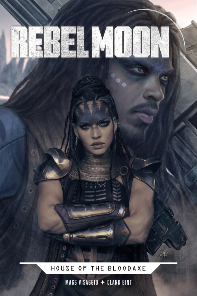 A White woman with a large tattoo on her forehead and long black dreadlocks, dressed in armor, stands with her arms crossed staring at the viewer. Behind her. the head of a White man with a beard and long black hair hovers above her, looking off to the reader's right. 