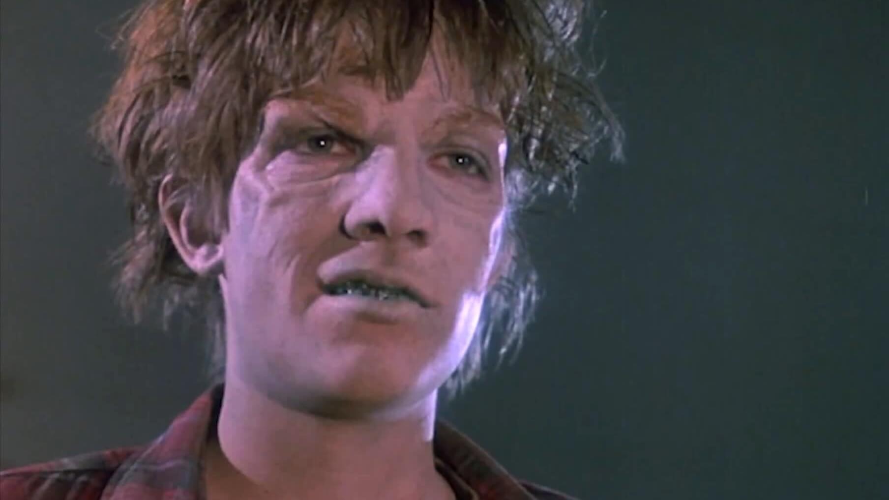 Still from the film Return of the Living Dead Part II. A zombified teenage bully.
