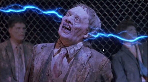 Still from the film Return of the Living Dead Part II. A zombie gets an electric shock.