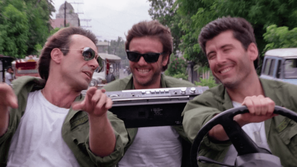 Still from the film Zombi 3 showing three soldiers in a Jeep.