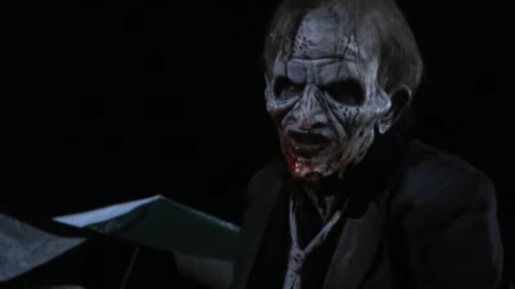 Still from the film Children of the Living Dead. Shows the zombie Abbott Hayes with a bloodstained mouth.